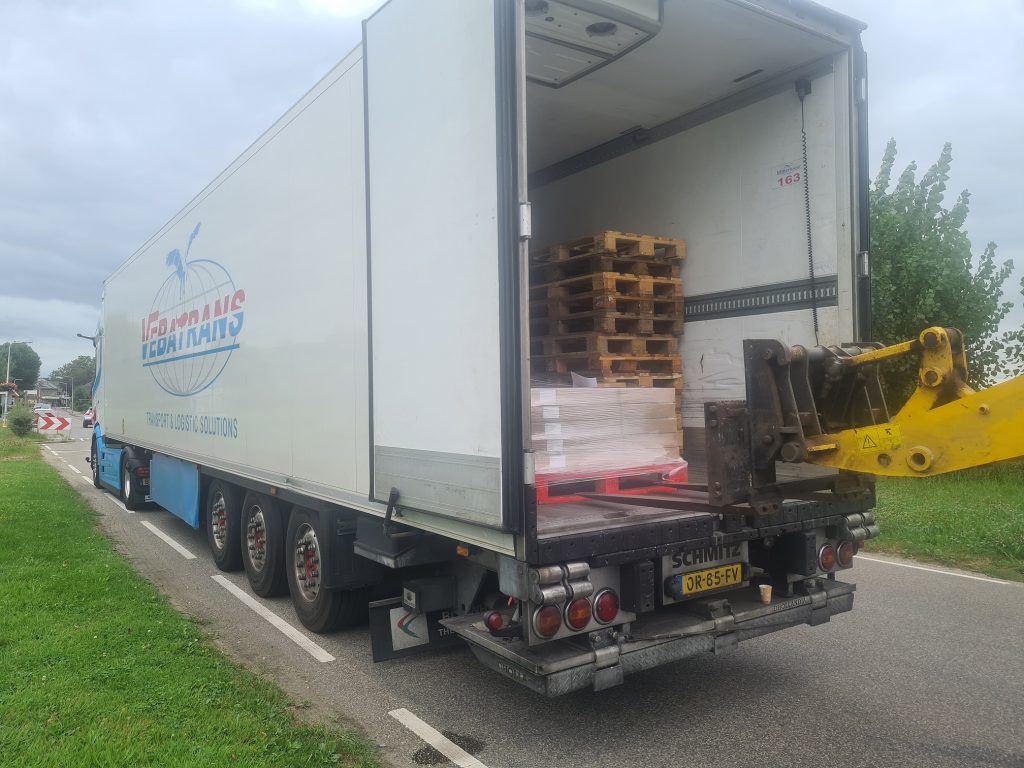 Refrigerated cheese transport of Craxi Gouda farm cheese loaded in the Netherlands on its way to the Craxi cheese shop in Malaga, Spain