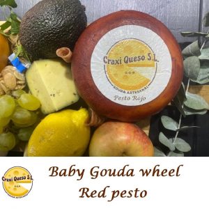 Gouda farmer's cheese baby wheel with red pesto, raw milk Gouda with red pesto herbs