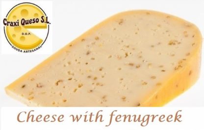 Gouda fenugreek cheese freshly cut after order from a 12 kilo raw milk farmer's Gouda (48+) cheese wheel with fenugreek