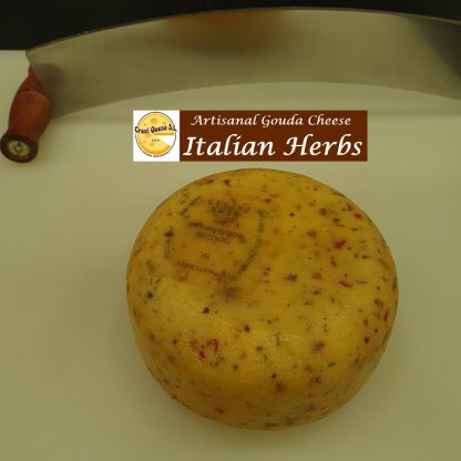 Baby Gouda Italian herbs cheese, small artisan raw milk Gouda with Italian herbs (dried tomato pieces, onion, paprika, garlic, basil, thyme, and pepper) with a cheese wheel weight of ±1 kg