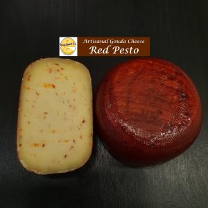 Artisanal raw milk mini Gouda red pesto cheese with red pesto spices & herbs (chillies, pepper, basil, garlic, oregano leaf, and paprika) with a cheese wheel weight of ±500gr.
