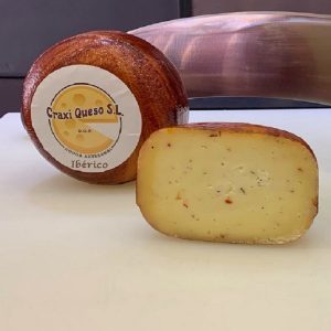 Craxi Baby Gouda Iberian herbs cheese, a small artisan Gouda cheese wheel with a weight of ±1 kilo with pieces of dried tomato & Iberian herbs