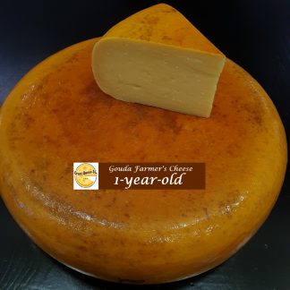 A whole cheese wheel of artisan Gouda cheese 12 months, 1-year-old raw milk Dutch Gouda cheese, order online Gouda farmer's cheese in 500g or in a 1-kilo wedge