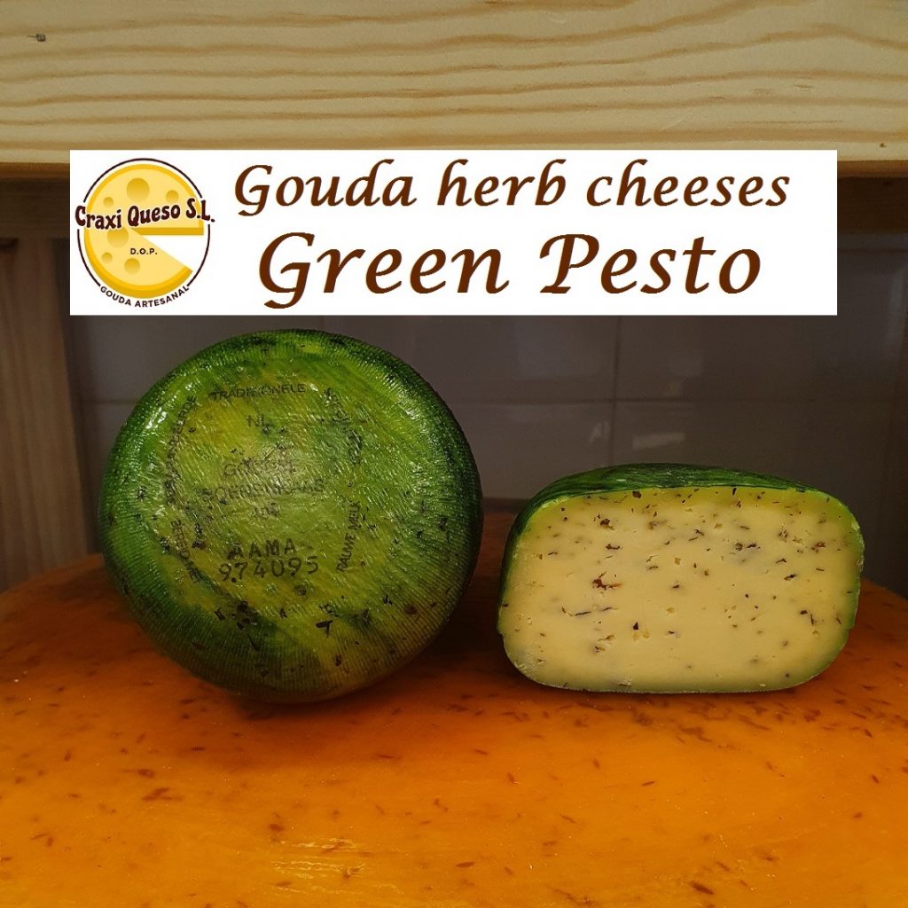 Craxi green pesto cheese. Artisan Gouda cheese made with raw cow milk with green pesto herbs