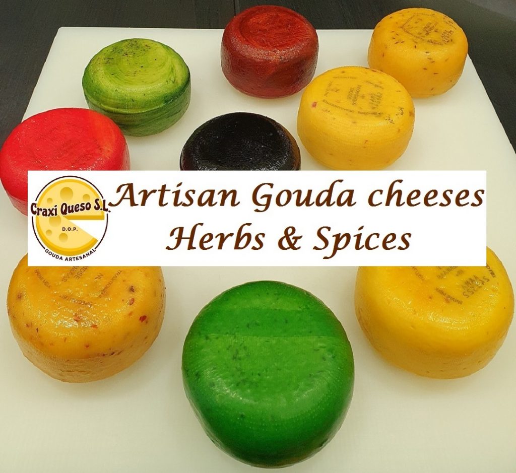 Aromatic cheese made with raw cow milk with spices and fresh herbs, artisanal Gouda farmer's cheese
