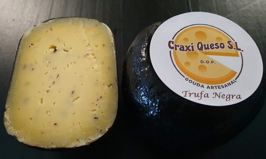 Gourmet Gouda with Truffle. Artisan farmstead Gouda cheese with black truffle