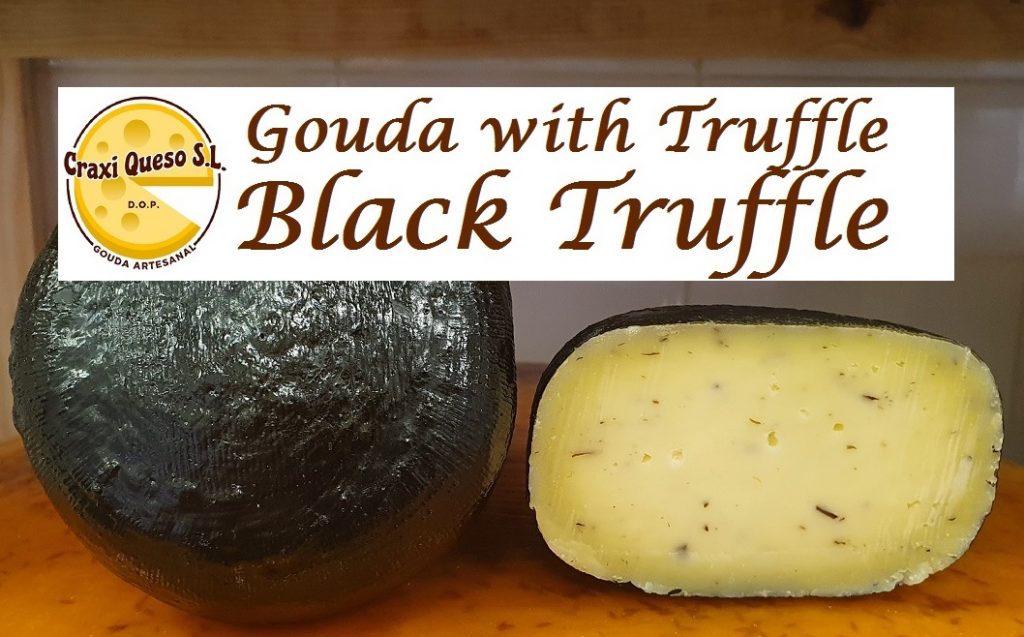 Gouda with truffle. Artisanal raw milk (cow) Gouda cheese with black truffle