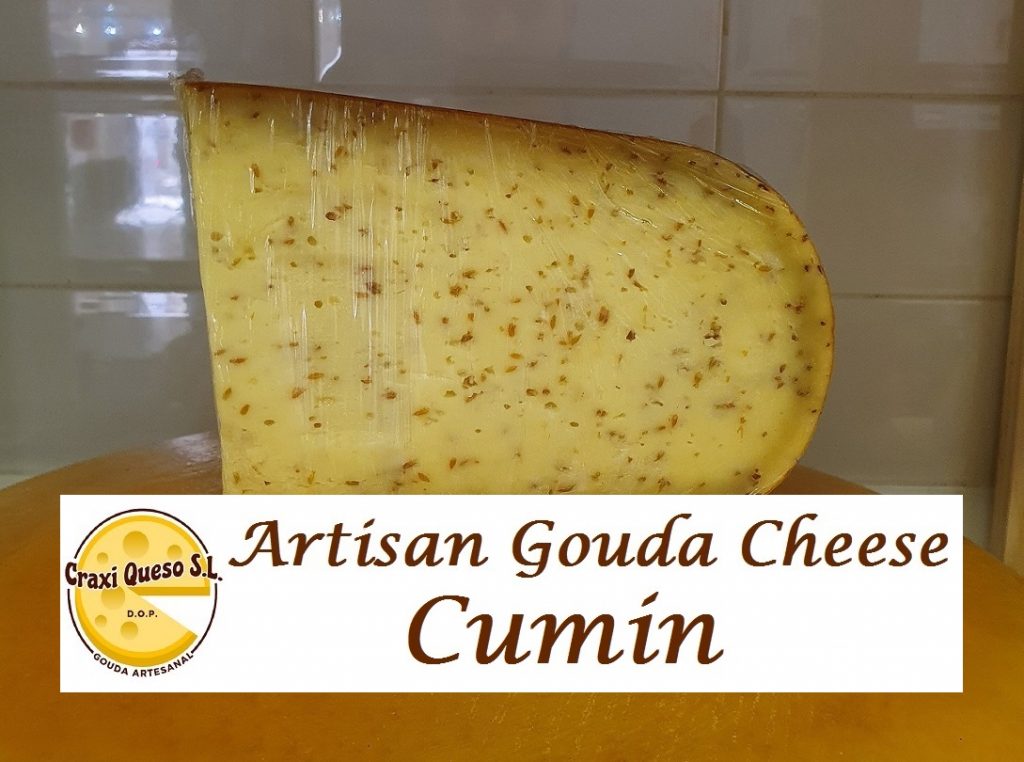 Craxi Gouda cheese with cumin, creamy texture and spiced flavor. Artisanal Gouda farmhouse cheese with cumin seeds.